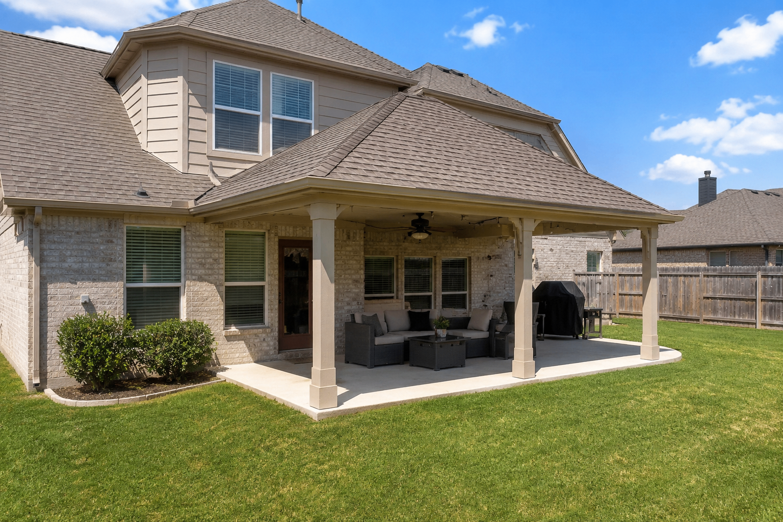 Shingle patio roof on brick home - 1st Capital Certified Roofing Austin TX