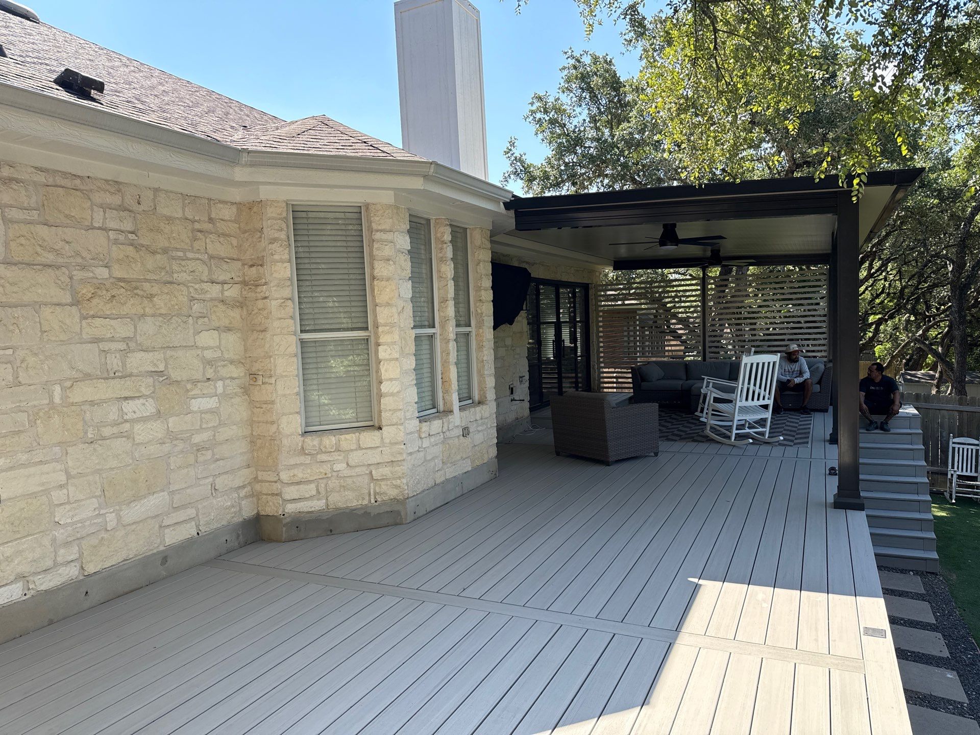 Covered patio with composite deck and privacy screen - Austin TX