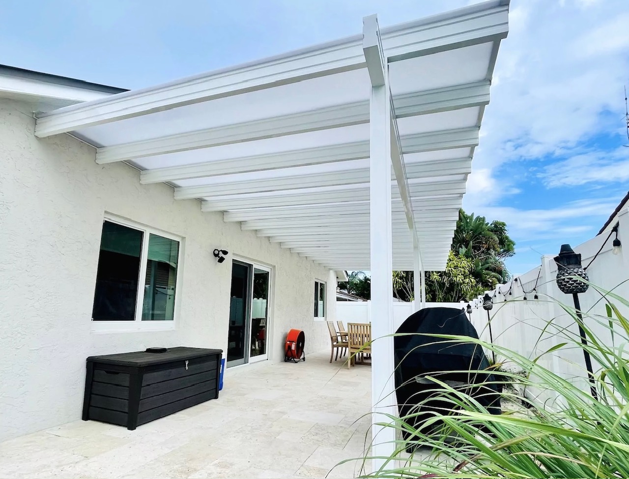 Dark louvred pergola with privacy screen Austin TX